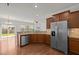 Kitchen with stainless steel appliances, granite countertops, breakfast bar and view into the living room at 2036 October Dr, Durham, NC 27703