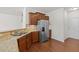 Cozy kitchen featuring granite countertops, stainless steel appliances and wooden cabinets at 2036 October Dr, Durham, NC 27703