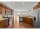 Open kitchen showcasing stainless steel appliances, granite counters, and a view to the living area at 2036 October Dr, Durham, NC 27703
