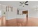 Open-concept living area with hardwood floors connecting the living room and kitchen at 2036 October Dr, Durham, NC 27703