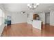 Open concept: living room with fireplace flows into kitchen with breakfast bar and stainless steel appliances at 2036 October Dr, Durham, NC 27703