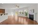 Spacious living room with hardwood floors, a fireplace, and sliding glass doors at 2036 October Dr, Durham, NC 27703