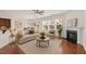 Cozy living room with a fireplace, comfortable seating, and ample natural light at 2036 October Dr, Durham, NC 27703