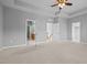 Spacious main bedroom with tray ceilings and multiple entry ways to closets and en-suite bathroom at 2036 October Dr, Durham, NC 27703
