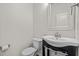 Well-lit powder room features a sleek vanity and fixtures at 2036 October Dr, Durham, NC 27703