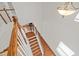 Open staircase features hardwood steps, white railings, and modern lighting, adding architectural interest at 2036 October Dr, Durham, NC 27703