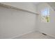 A walk-in closet features a wire shelving system and a window view at 2036 October Dr, Durham, NC 27703