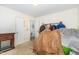 Bedroom with a fireplace, clothes rack and walk-in closet at 205 Person St, Oxford, NC 27565