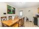 View of a dining area with a wooden table and chairs, along with art work hanging on the wall at 205 Person St, Oxford, NC 27565
