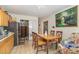 View of a dining area with a wooden table, chairs and a refrigerator at 205 Person St, Oxford, NC 27565