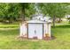 Backyard storage shed made of rusted metal with brick supports at 205 Person St, Oxford, NC 27565