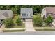 Aerial view of a residential home with a two-car garage, situated on a landscaped lot at 205 Willow Weald Ct, Fuquay Varina, NC 27526