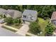 Aerial view of a residential home featuring a manicured lawn and mature trees at 205 Willow Weald Ct, Fuquay Varina, NC 27526