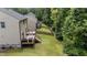 The home features a backyard and wood deck with built-in seating at 205 Willow Weald Ct, Fuquay Varina, NC 27526