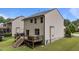 This is the back of the home with a wooden deck at 205 Willow Weald Ct, Fuquay Varina, NC 27526