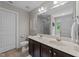 Bathroom with double sink vanity, a toilet, and a shower with glass door at 205 Willow Weald Ct, Fuquay Varina, NC 27526