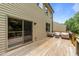 Spacious wooden deck with outdoor seating and natural light near sliding glass door at 205 Willow Weald Ct, Fuquay Varina, NC 27526
