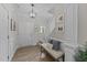 Bright foyer with neutral walls features stairs, bench seating, and lovely floors at 205 Willow Weald Ct, Fuquay Varina, NC 27526