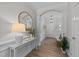 Bright foyer features archway, beautiful floors, neutral walls, and a lovely table decor at 205 Willow Weald Ct, Fuquay Varina, NC 27526