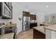 Kitchen with stainless appliances, granite counters, breakfast nook, and lots of pantry storage space at 205 Willow Weald Ct, Fuquay Varina, NC 27526