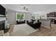 Open-concept living room features a dining area and kitchen island with bar seating at 205 Willow Weald Ct, Fuquay Varina, NC 27526