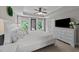 Beautiful main bedroom with white furniture, large windows, and a tray ceiling at 205 Willow Weald Ct, Fuquay Varina, NC 27526
