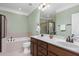 Spacious bathroom featuring a double vanity, soaking tub, and tiled shower at 215 Dungarven Loop, Cary, NC 27513