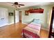 Bright bedroom with hardwood floors, and a comfortable bed at 215 Dungarven Loop, Cary, NC 27513