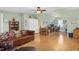 Spacious bonus room features hardwood floors, a ceiling fan, and flexible living and office space at 215 Dungarven Loop, Cary, NC 27513