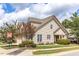Beautiful two-story home with tidy landscaping, including a small tree with magenta flowers at 215 Dungarven Loop, Cary, NC 27513