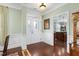 Welcoming foyer with hardwood floors and a decorative front door, making a great first impression at 215 Dungarven Loop, Cary, NC 27513