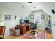 Comfortable home office space with wood desk, office chair, and natural light from a window at 215 Dungarven Loop, Cary, NC 27513