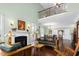 Inviting living room with a fireplace, tall windows, and an open floorplan, great for relaxation at 215 Dungarven Loop, Cary, NC 27513