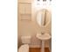 Cozy bathroom with toilet, sink, mirror and overhead storage at 227 Shalimar Dr, Durham, NC 27713