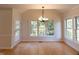 A dining room boasting hardwood floors, natural light, and a view to the exterior at 227 Shalimar Dr, Durham, NC 27713