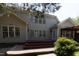 Back of house featuring siding, windows, deck, and brick paver patio at 227 Shalimar Dr, Durham, NC 27713