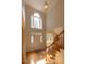 Grand two-story foyer with hardwood floors, a large window, and staircase at 227 Shalimar Dr, Durham, NC 27713