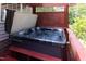 Hot tub featuring wood deck surround and privacy screen at 227 Shalimar Dr, Durham, NC 27713