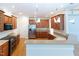 Spacious kitchen with stainless steel appliances, wooden cabinetry, and breakfast bar at 227 Shalimar Dr, Durham, NC 27713