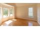 Bright living room featuring hardwood floors, large windows and natural light at 227 Shalimar Dr, Durham, NC 27713