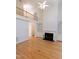 Spacious living room with hardwood floors, a fireplace, and built-in bookshelves at 227 Shalimar Dr, Durham, NC 27713