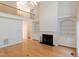 Spacious living room with hardwood floors, a fireplace, and built-in bookshelves at 227 Shalimar Dr, Durham, NC 27713