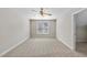 Clean bedroom with neutral color paint, carpet, and ceiling fan at 2409 Horizon Hike Ct, Raleigh, NC 27603