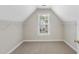 Bedroom with neutral carpet, paint, and trim with natural light at 2409 Horizon Hike Ct, Raleigh, NC 27603