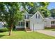 Two-story home with light-blue siding, a two-car garage, and a well-maintained lawn at 2409 Horizon Hike Ct, Raleigh, NC 27603