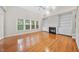 Bright living room with fireplace, built-in shelving, and large windows at 2409 Horizon Hike Ct, Raleigh, NC 27603