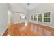 Open living room with hardwood floors and natural light looking to the kitchen at 2409 Horizon Hike Ct, Raleigh, NC 27603