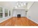 Bright living room features a fireplace, built-in shelves, and a high ceiling at 2409 Horizon Hike Ct, Raleigh, NC 27603