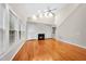 Spacious living room with fireplace, ceiling fan, and bright natural light at 2409 Horizon Hike Ct, Raleigh, NC 27603