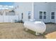Large propane tank in a spacious backyard with a white fence and generator at 254 Arlie Ln, Lillington, NC 27546